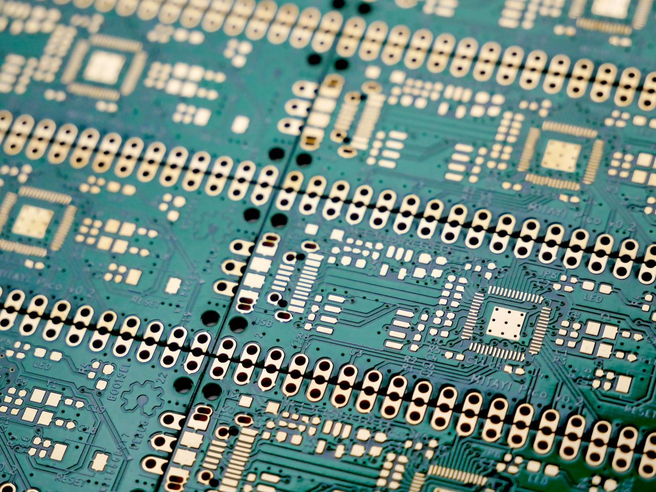 Bare printed circuit board showing high-density traces and pads